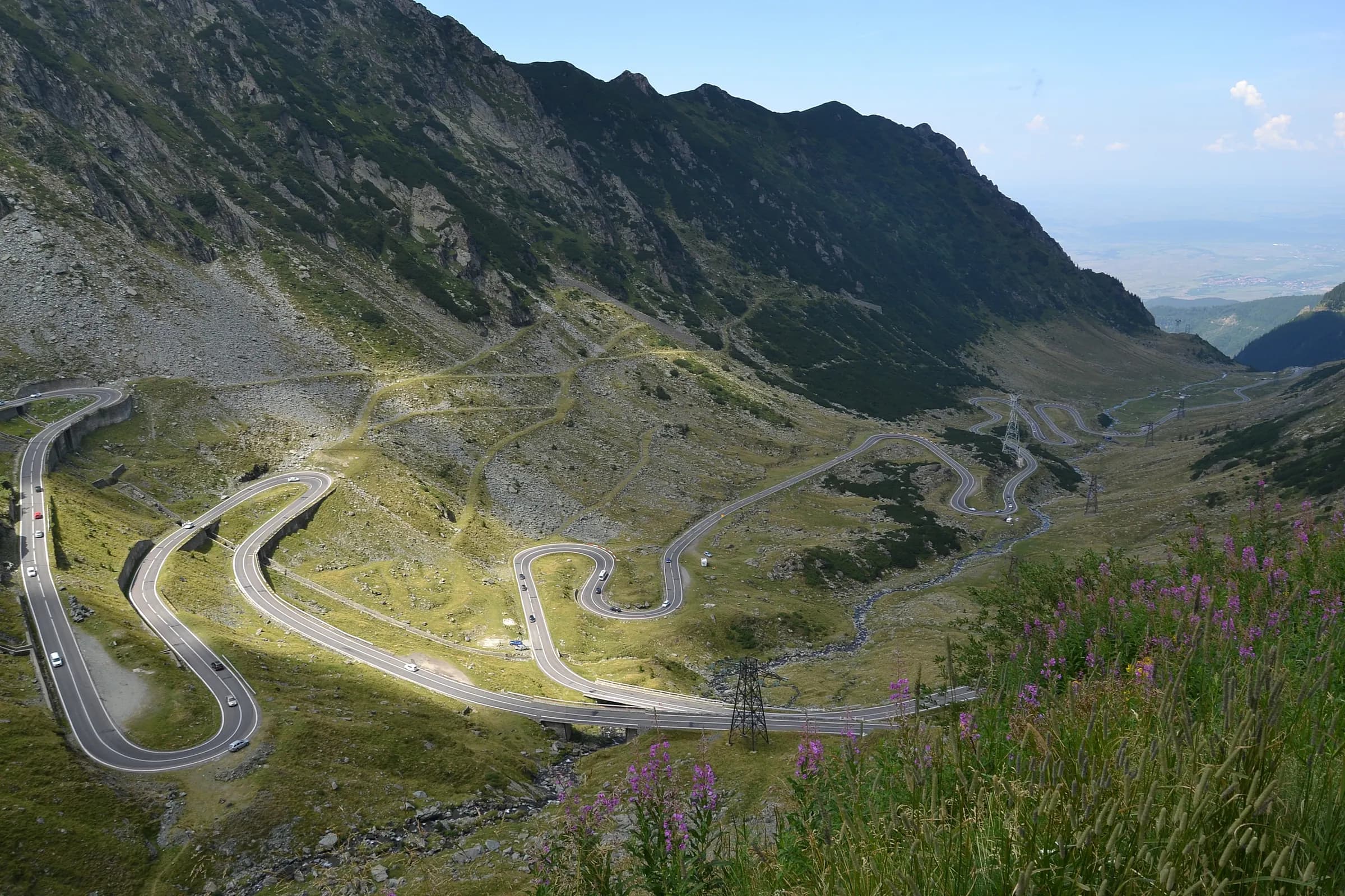 The Transfăgărășan road zigzagging through a glacial valley